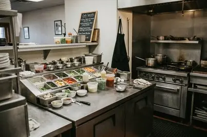 Chef reviewing service notes in restaurant kitchen